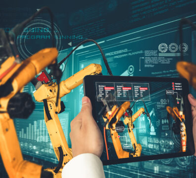 Engineer controls robotic arms by augmented reality industry technology application software. Smart robot machine in future factory working in concept of Industry 4.0 or 4th industrial revolution.